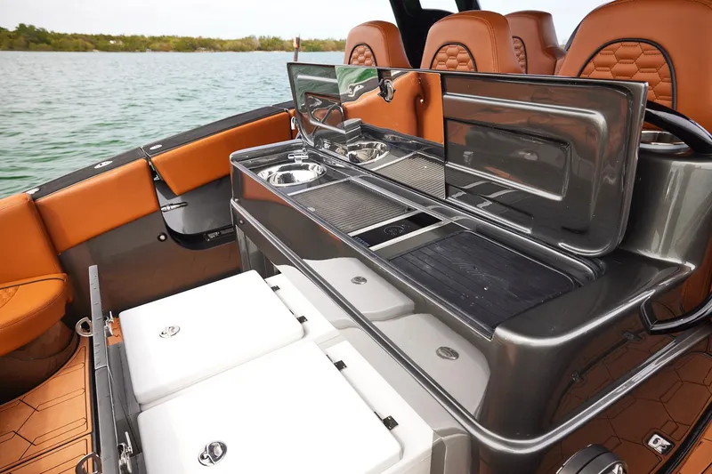 Slide: The Image of 2024 Midnight Express 43 Solstice boat interior with luxurious seating and modern amenities. - 17