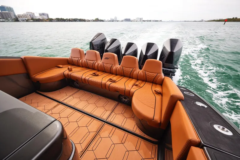 Slide: The Image of 2024 Midnight Express 43 Solstice luxury boat interior with leather seating and powerful engines. - 19