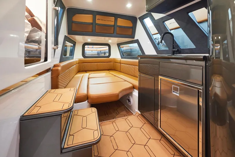 Slide: The Image of Luxurious interior of 2024 Midnight Express 43 Solstice boat with leather seating and modern kitchenette. - 20