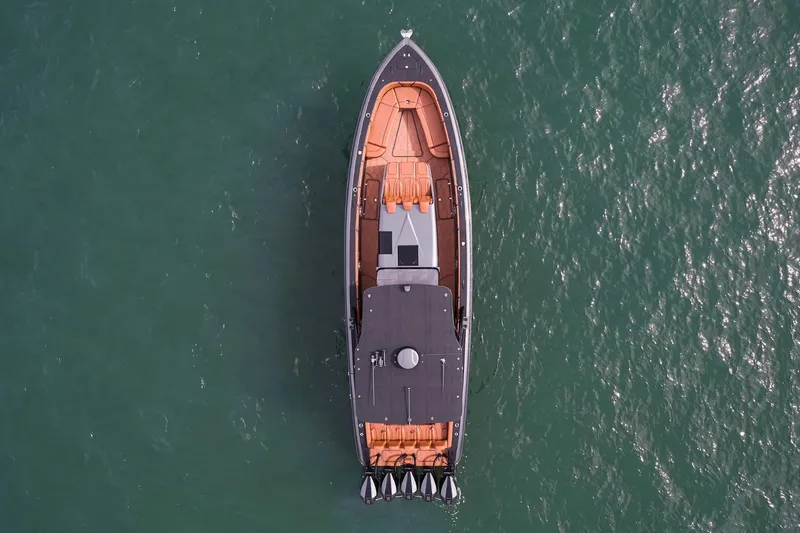 Slide: The Image of Aerial view of 2024 Midnight Express 43 Solstice yacht on open water. - 3