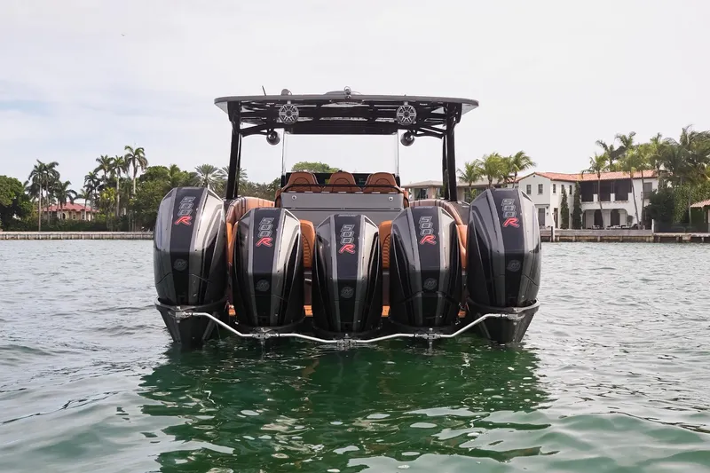 Slide: The Image of 2024 Midnight Express 43 Solstice boat with multiple powerful outboard engines on water. - 6