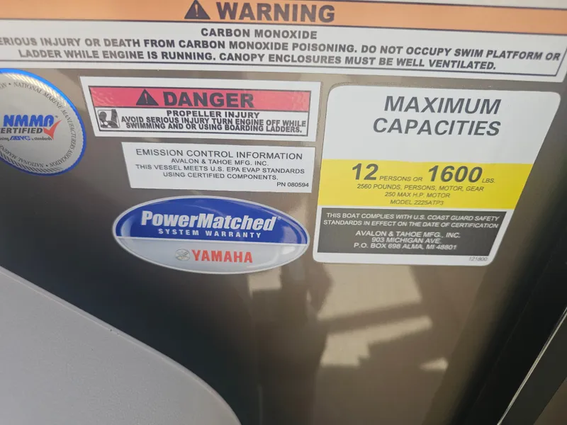Slide: The Image of Warning labels and capacity details on Avalon LSZ 2385 Pontoon. - 28