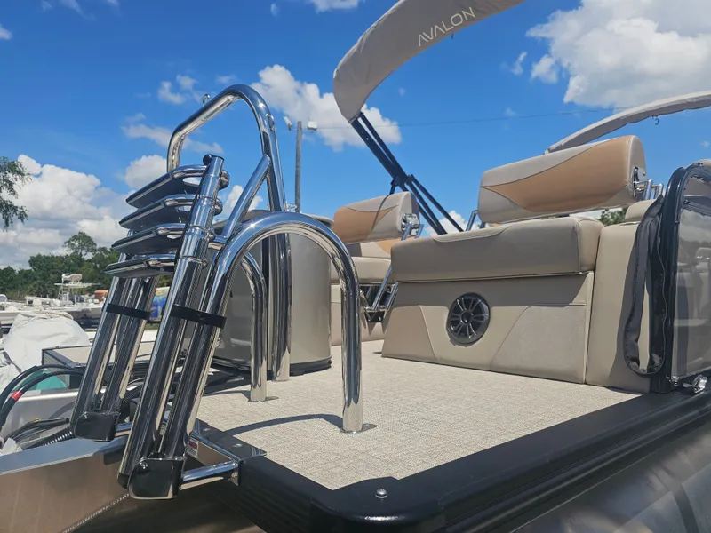 Slide: The Image of Avalon LSZ 2385 Tritoon with luxury seating and stainless steel ladder, 2026 model. - 35