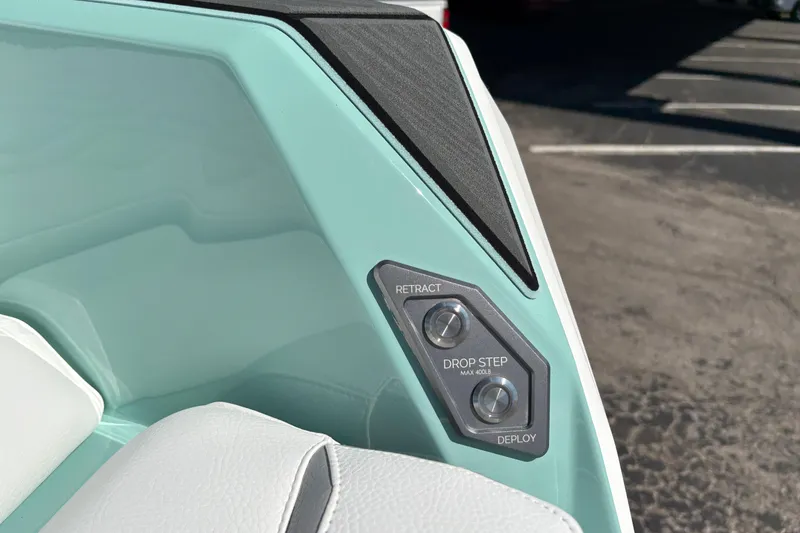 Slide: The Image of 2026 Supra SA 550 boat control panel with retract and deploy buttons. - 12