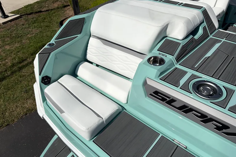 Slide: The Image of 2026 Supra SA 550 boat interior with white seating and teal accents. - 14