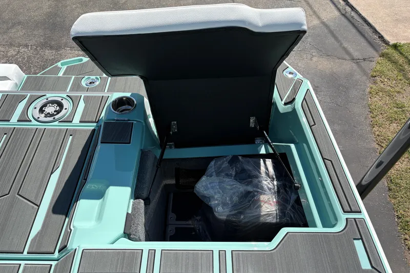 Slide: The Image of 2026 Supra SA 550 boat storage compartment with open hatch, showcasing sleek design and functionality. - 16