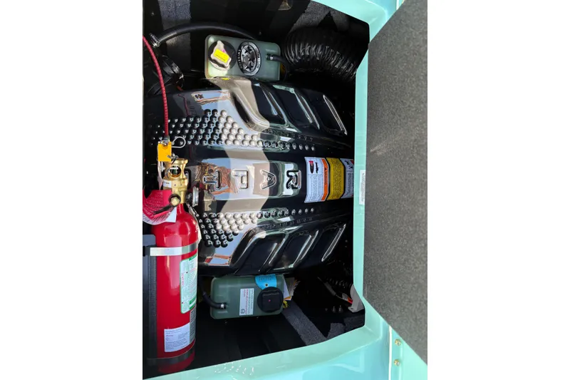 Slide: The Image of 2026 Supra SA 550 engine compartment with fire extinguisher and detailed components. - 18