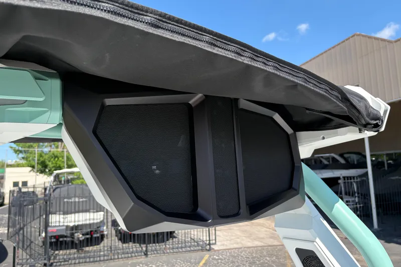 Slide: The Image of 2026 Supra SA 550 boat speaker system under canopy, outdoor setting. - 21
