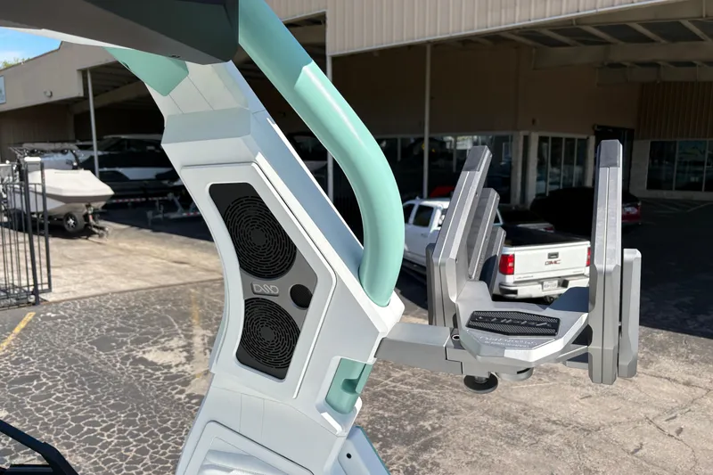 Slide: The Image of 2026 Supra SA 550 boat tower with speakers and wakeboard rack in a marina setting. - 22