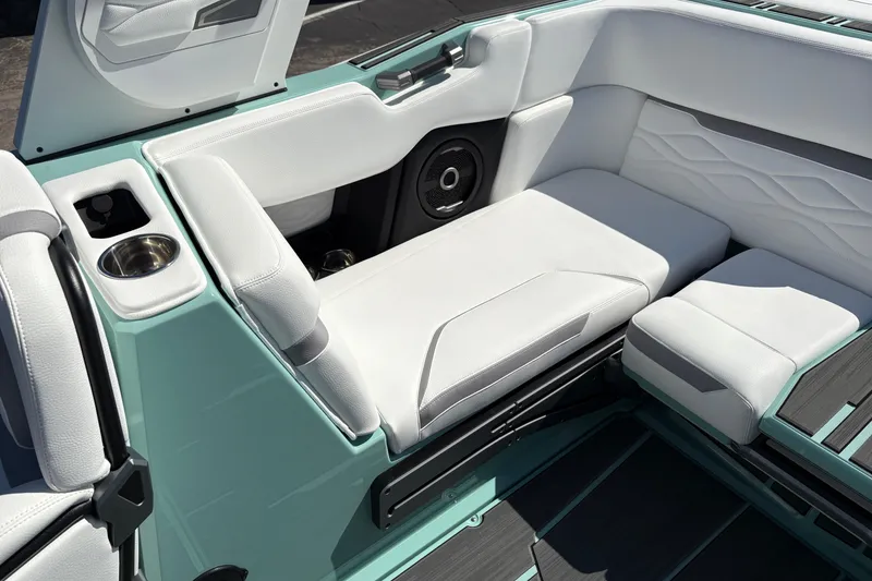 Slide: The Image of 2026 Supra SA 550 boat interior with white seating and cup holder. - 27