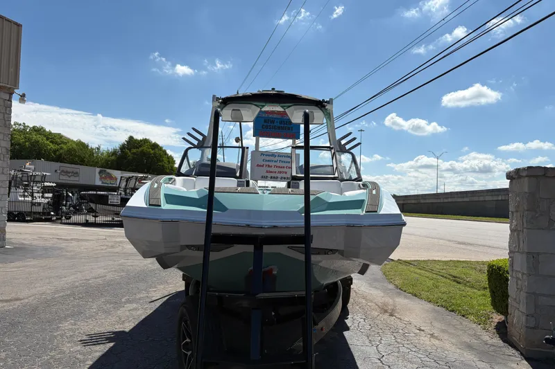 Slide: The Image of 2026 Supra SA 550 boat displayed outdoors under a clear blue sky. - 3