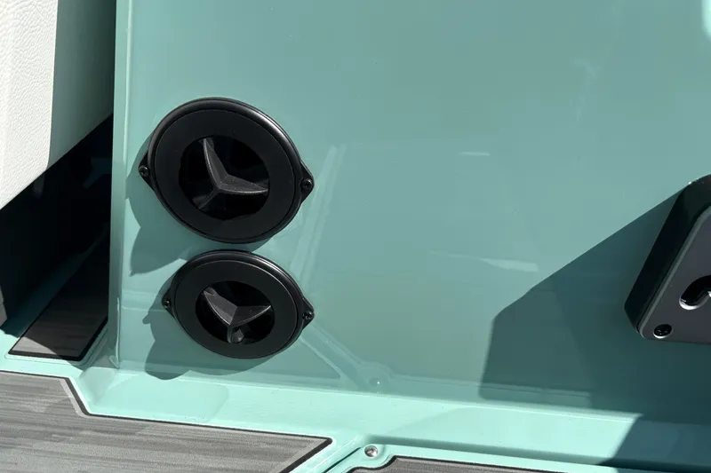 Slide: The Image of 2026 Supra SA 550 boat detail with dual black vents on teal surface. - 32