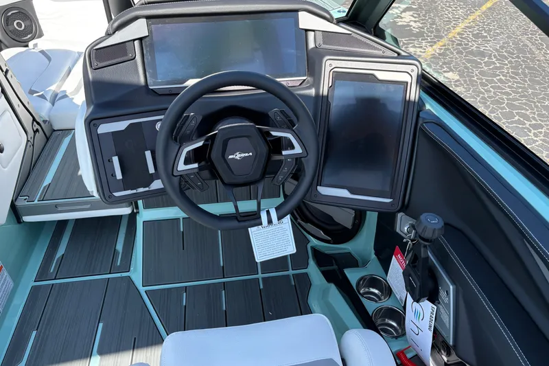 Slide: The Image of 2026 Supra SA 550 boat dashboard with modern steering and digital displays. - 33