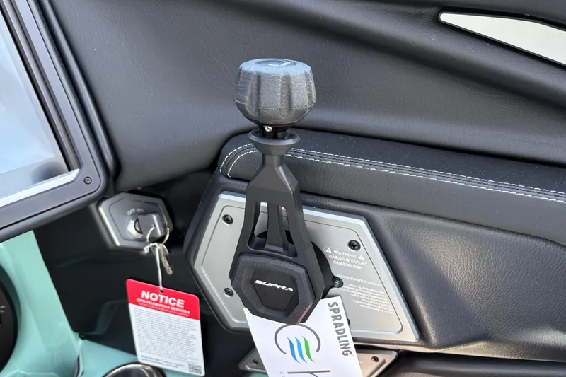 Slide: The Image of Interior of 2026 Supra SA 550 featuring gear shift and ignition key. - 34