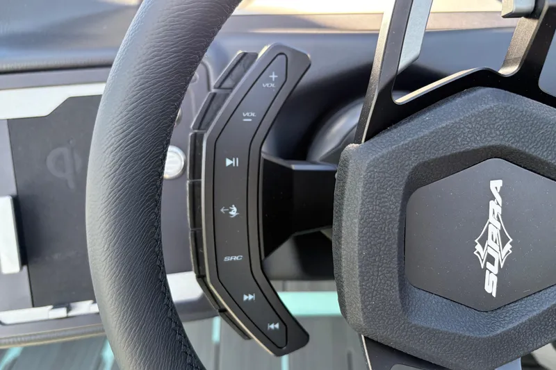 Slide: The Image of Steering wheel controls of 2026 Supra SA 550, featuring volume and media buttons. - 37