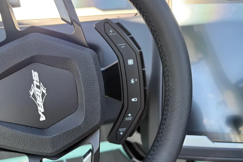 Slide: The Image of Steering wheel of 2026 Supra SA 550 with control buttons and logo. - 38