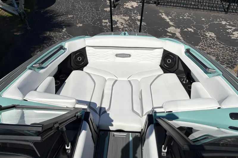 Slide: The Image of 2026 Supra SA 550 boat interior with white seating and integrated speakers. - 39