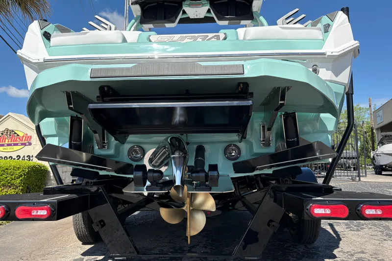 Slide: The Image of 2026 Supra SA 550 boat rear view with propeller and trailer. - 8