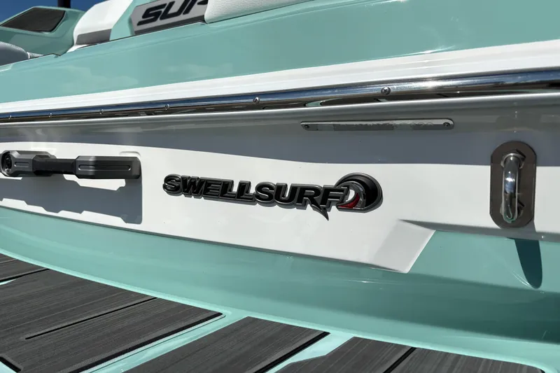 Slide: The Image of 2026 Supra SA 550 boat with SwellSurf technology, featuring sleek design and aqua accents. - 9