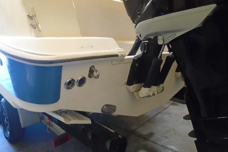 Slide: The Image of Rear view of a 2011 Boston Whaler 330 Outrage boat on a trailer. - 22