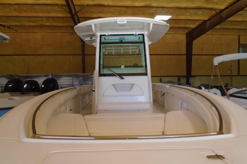 Slide: The Image of 2011 Boston Whaler 330 Outrage boat interior in a storage facility. - 26