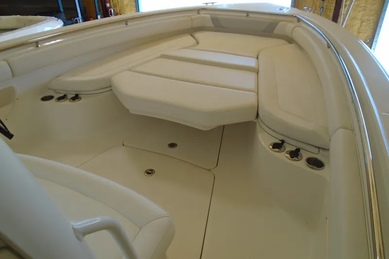 Slide: The Image of Interior view of 2011 Boston Whaler 330 Outrage boat with cushioned seating. - 15