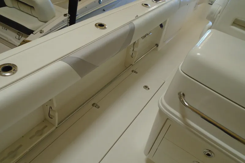 Slide: The Image of Interior view of 2011 Boston Whaler 330 Outrage boat, showcasing seating and storage. - 20