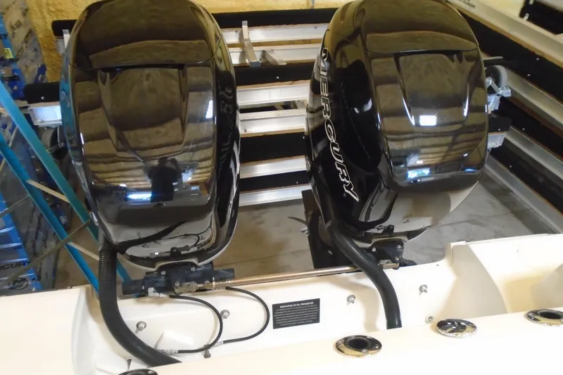 Slide: The Image of Twin Mercury outboard engines on a 2011 Boston Whaler 330 Outrage boat. - 21