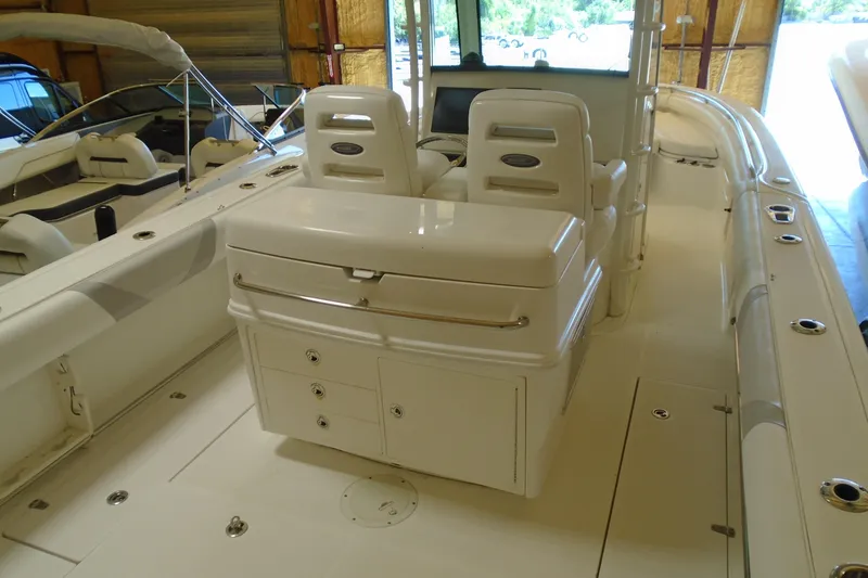 Slide: The Image of 2011 Boston Whaler 330 Outrage boat interior with seating and storage compartments. - 7