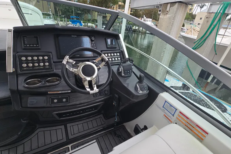 Slide: The Image of Cockpit of 2017 Monterey 355 Sport Yacht with modern controls and steering wheel. - 14