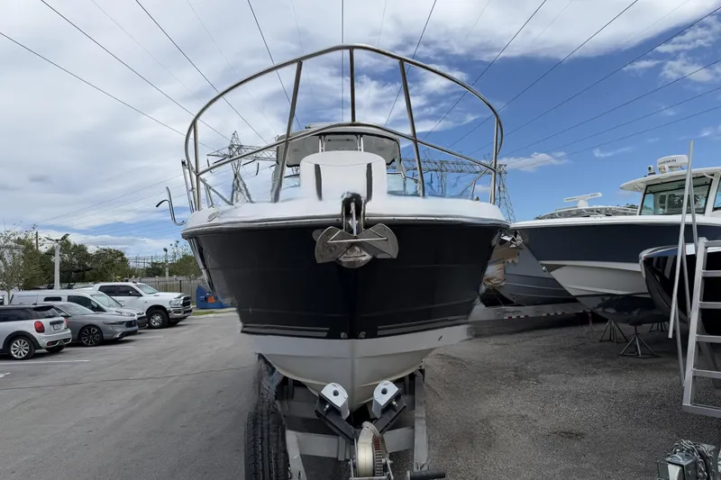 Slide: The Image of 2017 Monterey 355 Sport Yacht on trailer, parked outdoors under a cloudy sky. - 21