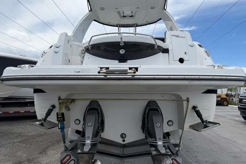 Slide: The Image of 2017 Monterey 355 Sport Yacht rear view with dual outboard motors. - 24