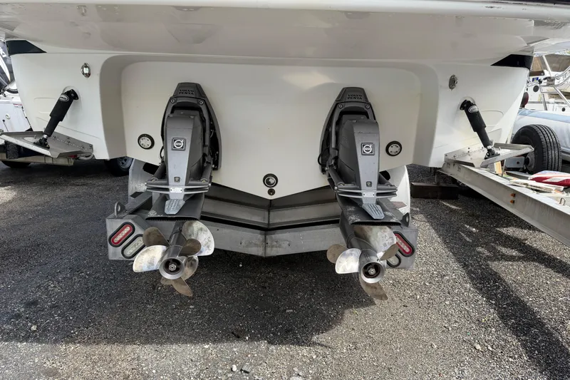 Slide: The Image of Rear view of 2017 Monterey 355 Sport Yacht with dual propellers on a trailer. - 29