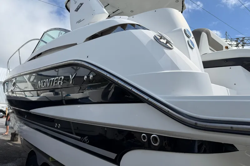 Slide: The Image of 2017 Monterey 355 Sport Yacht, sleek design, docked under a clear sky. - 31