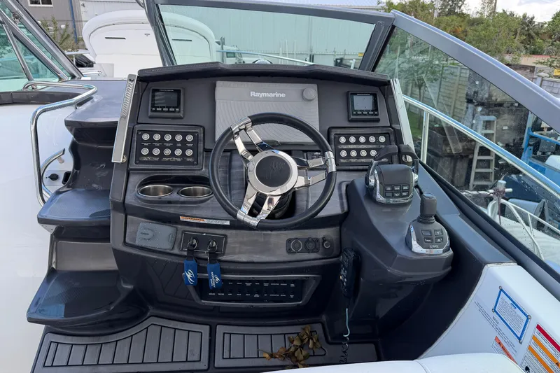 Slide: The Image of Cockpit of 2017 Monterey 355 Sport Yacht with steering wheel and control panel. - 33