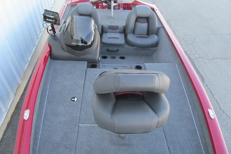 Slide: The Image of 2024 Tracker Pro Team 190 TX boat interior with gray seating and red accents. - 11