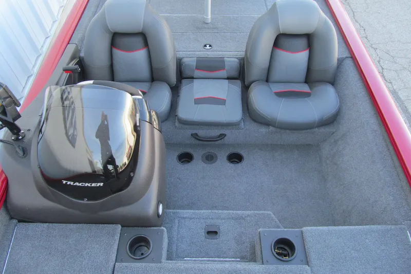 Slide: The Image of 2024 Tracker Pro Team 190 TX boat interior with gray seating and motor. - 12