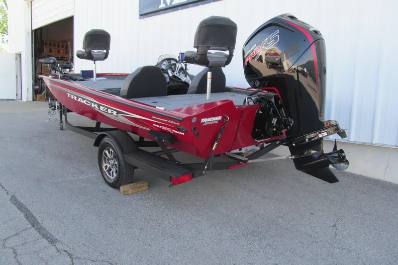 Slide: The Image of 2024 Tracker Pro Team 190 TX boat with Mercury engine, parked on a trailer. - 3
