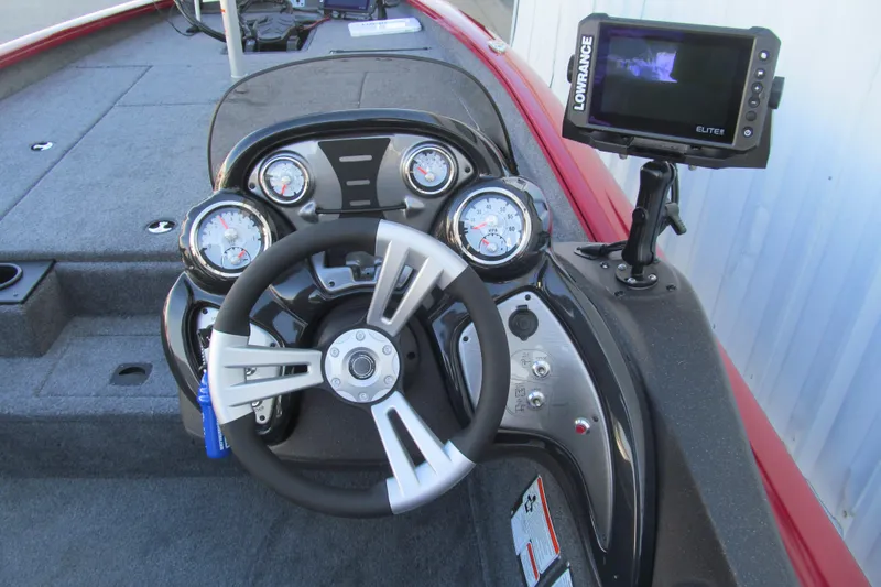Slide: The Image of 2024 Tracker Pro Team 190 TX boat dashboard with steering wheel and Lowrance Elite fishfinder. - 6