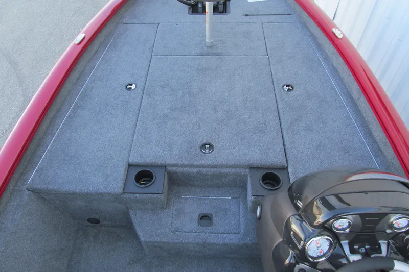 Slide: The Image of 2024 Tracker Pro Team 190 TX boat interior with gray carpet and red trim. - 7