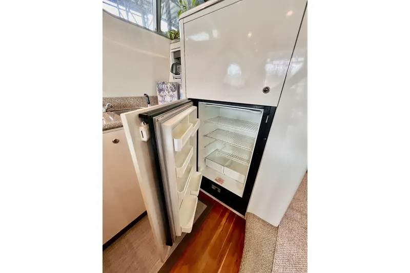 Slide: The Image of Open refrigerator in 1999 Maxum 4100 SCB yacht kitchen interior. - 15