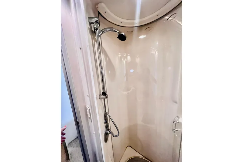 Slide: The Image of 1999 Maxum 4100 SCB yacht shower with chrome fixtures and sleek design. - 22