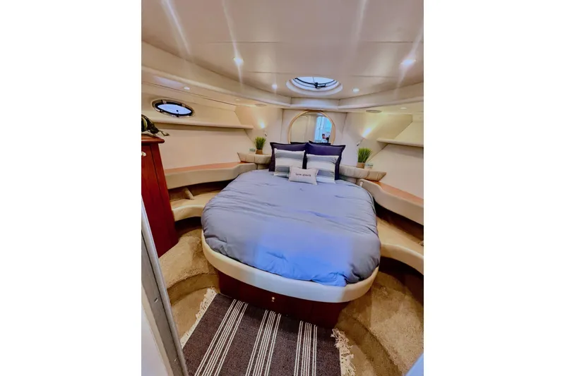 Slide: The Image of Luxurious cabin interior of 1999 Maxum 4100 SCB yacht with cozy bed and elegant decor. - 23