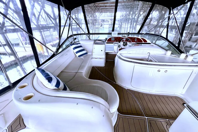 Slide: The Image of 1999 Maxum 4100 SCB yacht interior with plush seating and modern helm. - 32