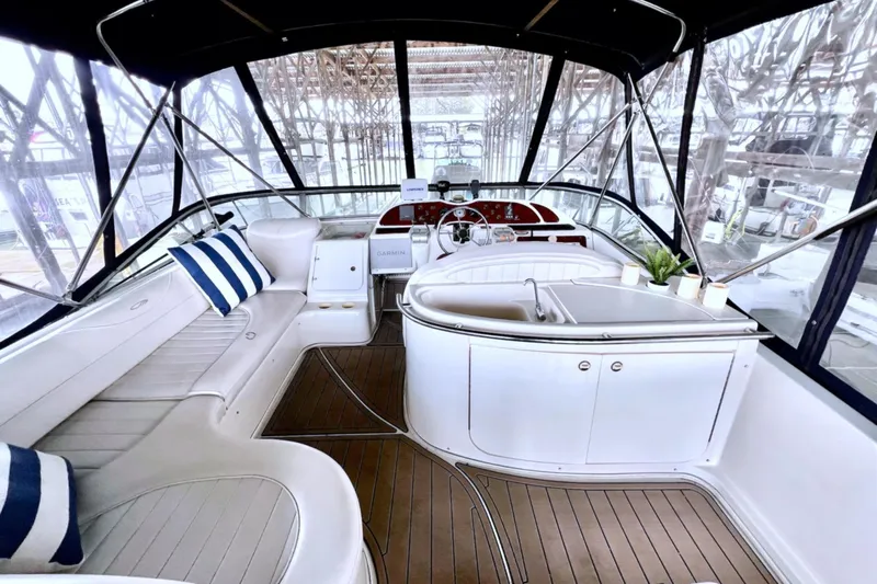 Slide: The Image of Luxurious interior of 1999 Maxum 4100 SCB yacht with plush seating and modern amenities. - 33