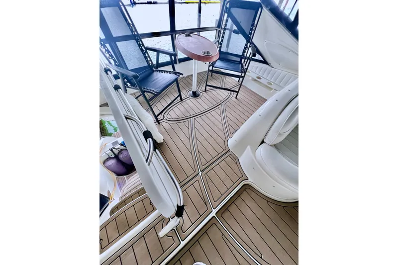 Slide: The Image of Interior of 1999 Maxum 4100 SCB yacht with stylish seating and wooden flooring. - 37