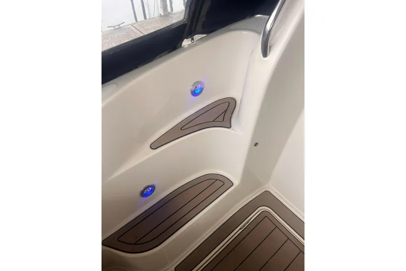 Slide: The Image of Interior view of 1999 Maxum 4100 SCB boat with blue LED lights and wood accents. - 39