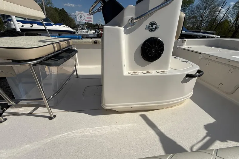 Slide: The Image of 2023 Carolina Skiff 19 LS boat interior with seating and console details. - 11