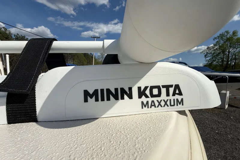 Slide: The Image of Minn Kota Maxxum motor on 2023 Carolina Skiff 19 LS boat under blue sky. - 13