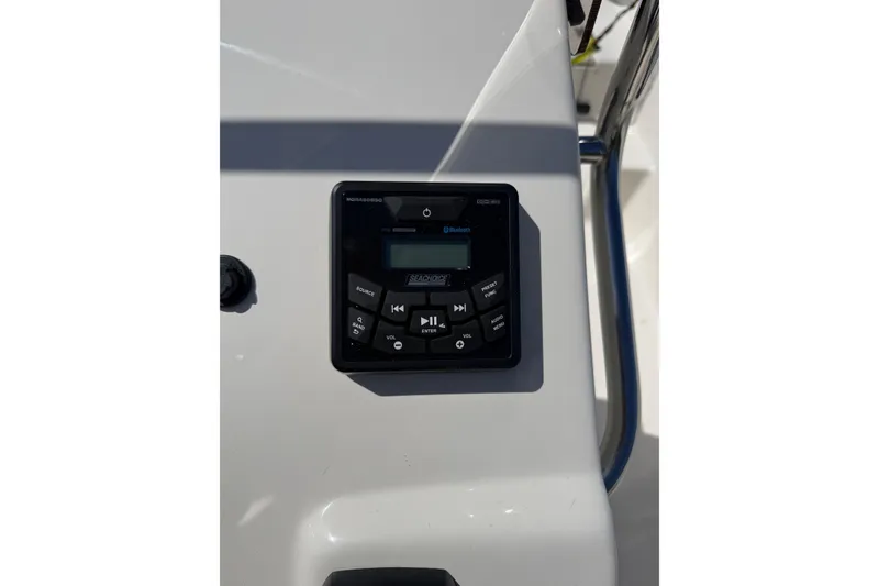 Slide: The Image of 2023 Carolina Skiff 19 LS boat console with Bluetooth audio system controls. - 15